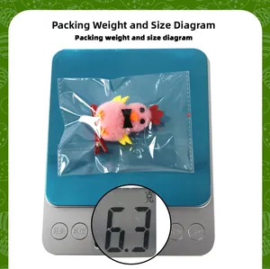 Pink plush chick hair clip weighing 6.3g on an electronic scale for weight measurement