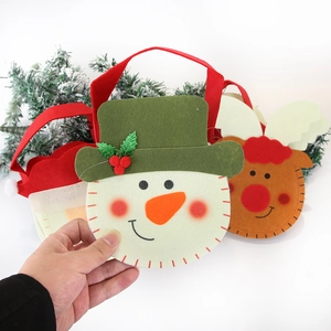 Christmas felt gift bags featuring cartoon snowman and reindeer with red handles