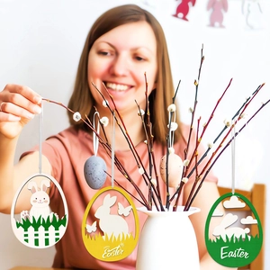 Detail of wooden Easter egg ornament featuring hollow-out rabbit and Happy Easter text