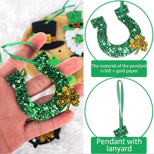 Detail of felt shamrock horseshoe pendant with gold glitter for St. Patrick's Day decor