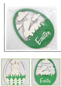 Detail view of laser-cut wooden Easter egg hanging ornaments with rabbit and garden motifs