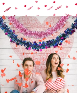 Detail of pink and blue tinsel garland with heart pendants for Valentine decorations
