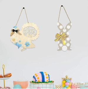Detailed view of wooden Easter bunny and hen door hangers with ribbons and twine
