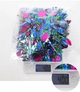 Mixed party tinsel garland with heart sequins being weighed on a scale 40g