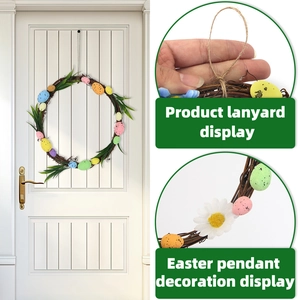 Easter wreath with rattan loop, colorful speckled eggs, green leaves and hanging rope
