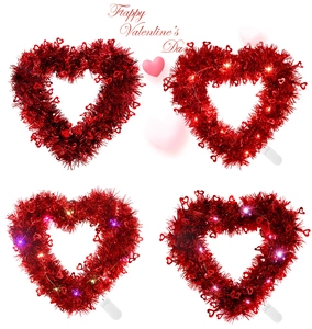 Macro detail of red sequin heart wreaths for Valentine's Day party with LED light strings