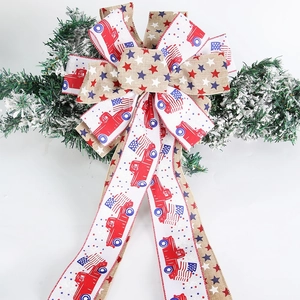 Patriotic Independence Day bow with red truck and flag stars design on green pine branch