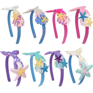 Eight colorful mermaid tail headbands with sequins and starfish for kids ocean parties