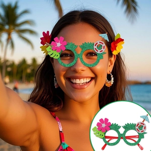 Detail of green glitter pineapple party glasses with tropical flower and palm leaf accents