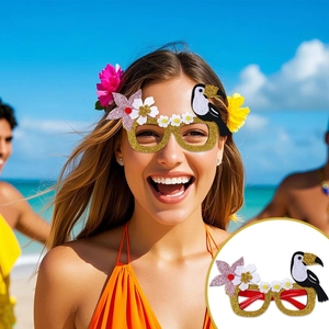 Detail of tropical party glasses with glitter gold frame, felt flowers, and a toucan element