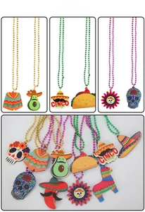 Macro detail of Cinco de Mayo party necklaces with glittery taco and cactus felt pendants