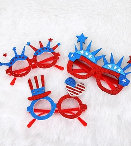 Detail of glitter July 4th glasses with patriotic star, heart, and top hat designs