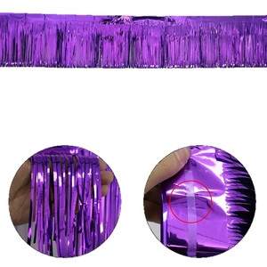 Purple metallic fringe curtain with adhesive backing for party wall decoration