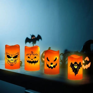 Halloween LED Kerzen in Orange mit Kürbis und Totenkopf Motiven für gruselige Party Deko