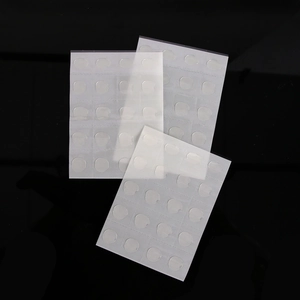 Macro detail of transparent double-sided adhesive glue dots for balloon and party decor