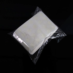 Detail of 100-piece pack double-sided transparent adhesive glue dots for party balloons