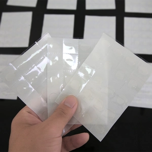 Close-up of double-sided clear glue dots for balloon decoration and DIY party crafts
