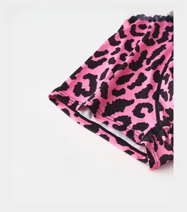 Detail of reinforced trouser cuffs featuring stylish pink and black leopard print pattern