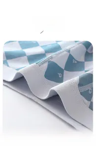 Detailed macro view of elastic waistband stitching on boys' cotton boxer briefs