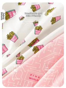 Close-up of 95% cotton fabric texture showing pink patterns and fries print details