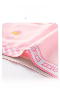 Detail of pink cotton underwear featuring elastic PINK WORLD waistband and fries embroidery