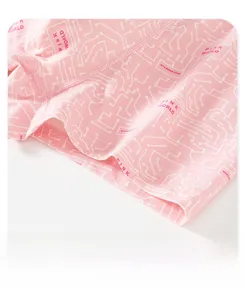 Macro detail of pink cotton boxer shorts featuring circuit patterns and double stitching