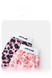 Detail of pink leopard print shorts with wide LOVE Yourself elastic waistband for women