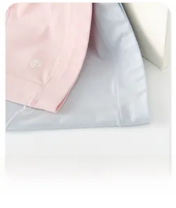 Detail shot of soft rib-knit modal panties in pink and blue with cute bear logo print