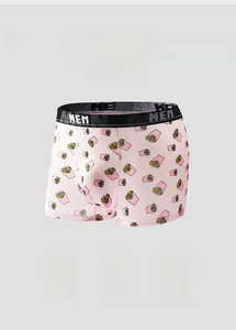 Close-up of pink boxer briefs with cartoon fries print and black elastic MEN waistband