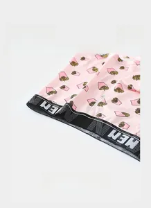 Detail view of pink boxer briefs with fries print and a wide black elastic waistband