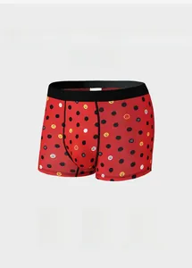 Detail of red ice silk men boxer briefs with yellow smiley face and wide black waistband
