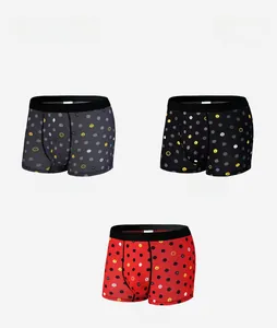 Close-up of three men's ice silk boxer briefs in grey, black and red with smiley prints