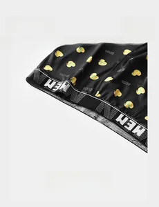 Close-up of lightweight elastic waistband on men's boxers with cute duck patterns