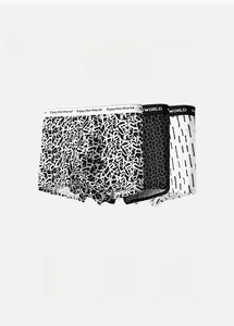 Detailed view of elastic waistband with lettering on three printed boxer briefs