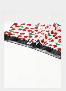 Detail of men's boxer briefs showing lightweight elastic waistband with cherry print fabric