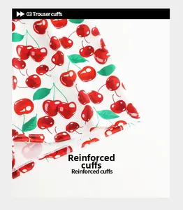 Detail of reinforced trouser cuffs with cherry print pattern on white breathable fabric