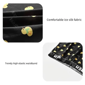 Breathable men's ice silk boxer briefs featuring yellow cartoon duck patterns and elastic waistband