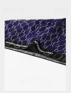 Detail of high-elastic black waistband with white lettering on navy blue boxer briefs
