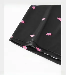 Detail of reinforced trouser cuffs featuring pink elephant prints on black ice silk boxers