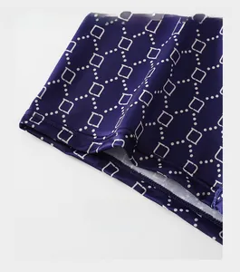 Close-up of reinforced cuffs on men's boxers with geometric pattern and double stitching