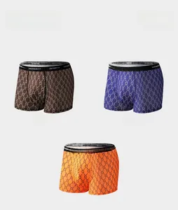 Detailed view of three breathable boxer briefs with geometric mesh patterns in multiple colors