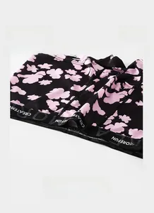 Close-up of elastic waistband on black men's ice silk boxer with pink cloud print