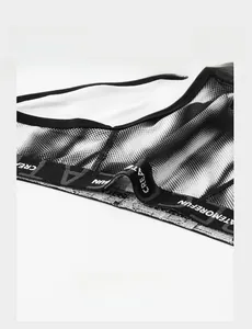 Detail of breathable mesh fabric and elastic waistband with letter print for men