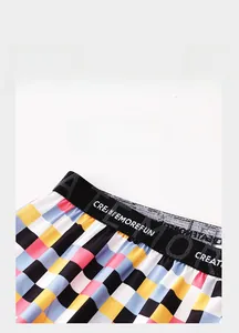 Close-up of the elastic waistband with text on colorful plaid ice silk boxer shorts