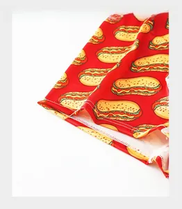 Close-up of reinforced trouser cuffs and red hot dog print on men's ice silk boxer briefs