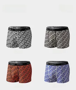 Close-up of men's boxer briefs in black, brown, orange, and blue with letter print