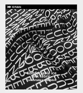Detailed macro view of breathable ice silk fabric with white letter print on black
