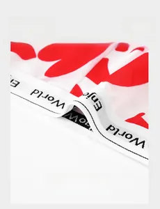 Detail of white men's boxers showing lightweight elastic waistband with red heart pattern