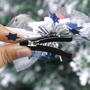Festive Christmas hair clip featuring white mesh bow with blue stars and snowman麋鹿 theme