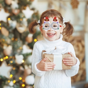 Child wearing festive Christmas hat glasses with silver tinsel and red sequin details